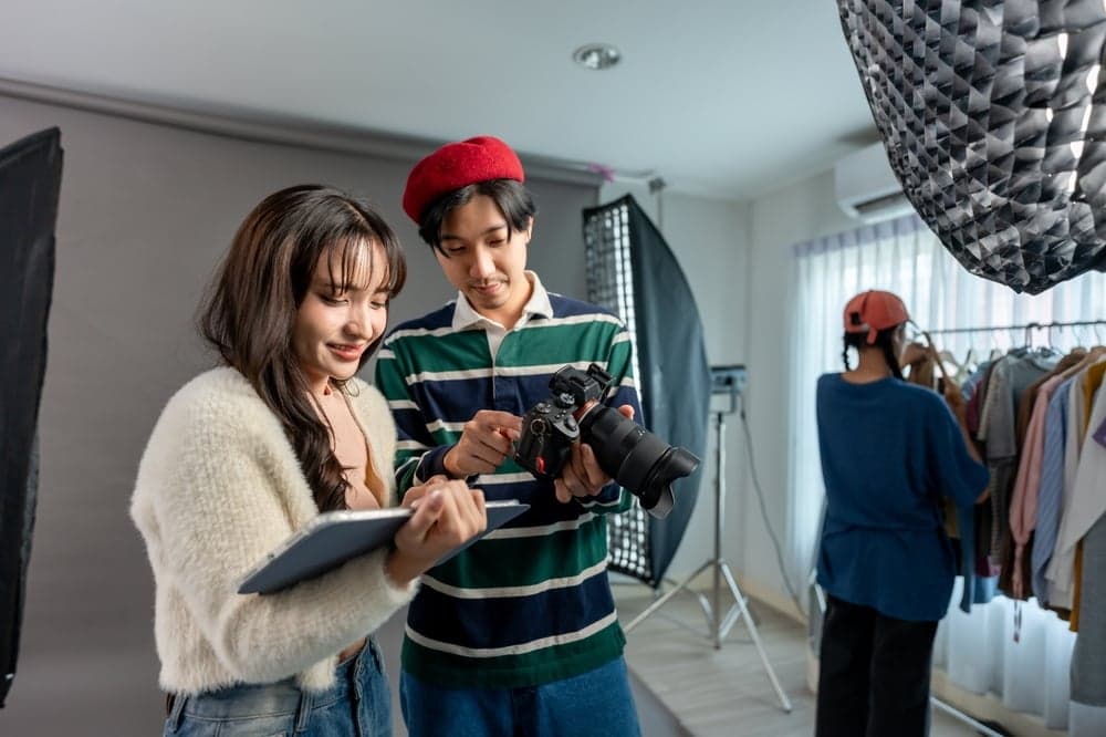 Photographer directing models during a branding photo and video shoot