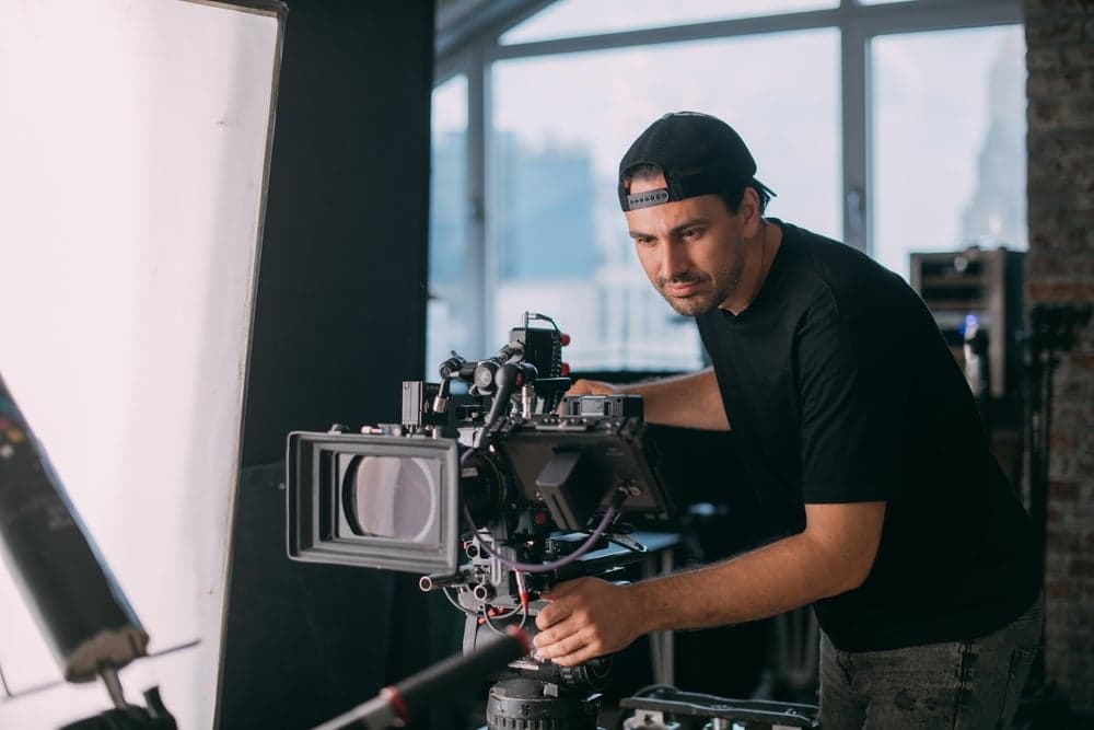 Camera operator monitoring a shot during a training video production
