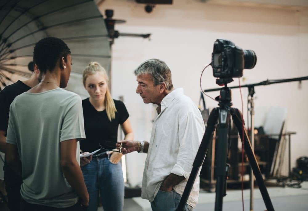 Photographer directing his shoot team on location