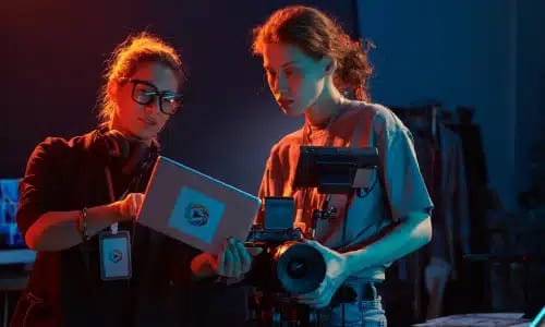 Videographers reviewing footage on a video production set in Ocala, FL